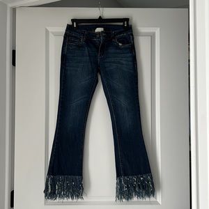 Medium wash low rise straight jeans with frills - size 26. Like new condition.